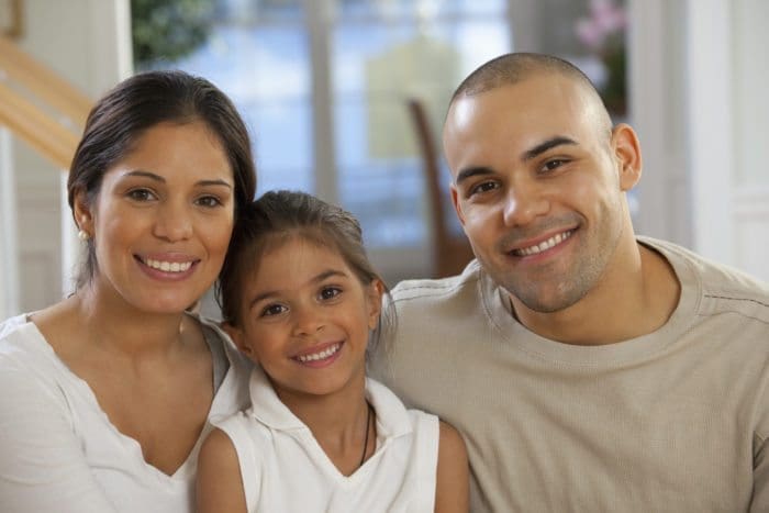 Image of a smiling family.