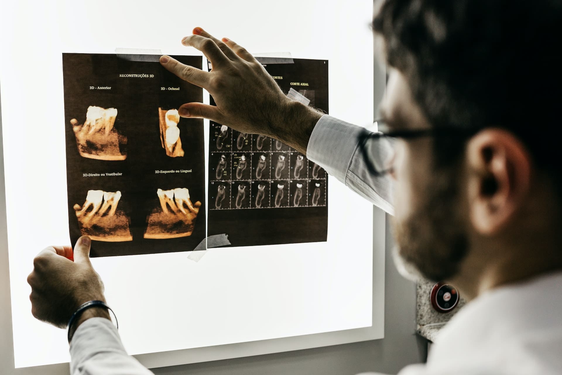 Dentist examining a dental X-ray at Sudbury Dental Arts.