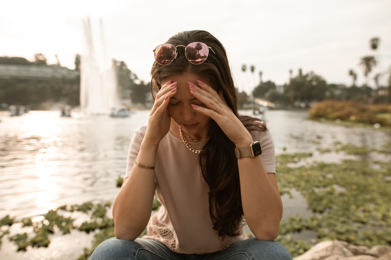 A woman experiencing social anxiety at Sudbury Dental Arts.