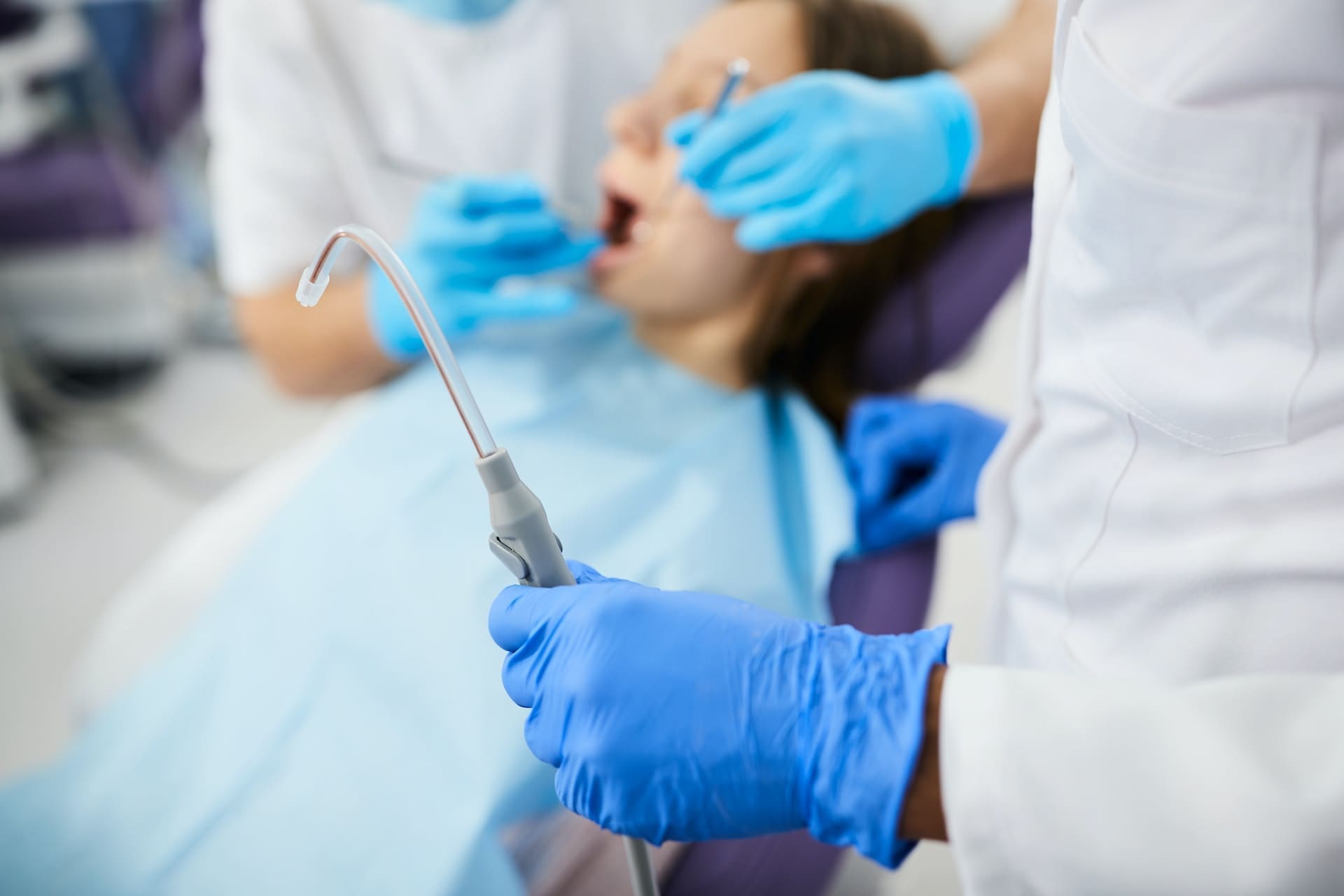 Dentist explaining to a patient when a surgical tooth extraction is necessary at Sudbury Dental Arts.