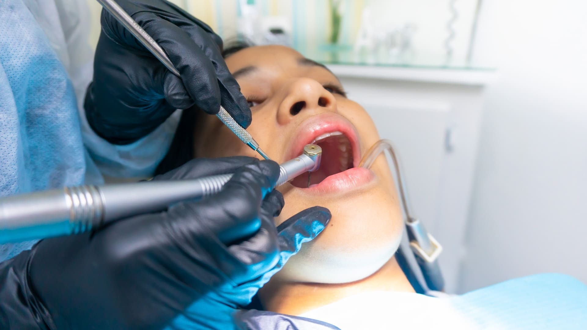 Dentist providing a lady with 6 dental bonding aftercare tips at Sudbury Dental Arts.