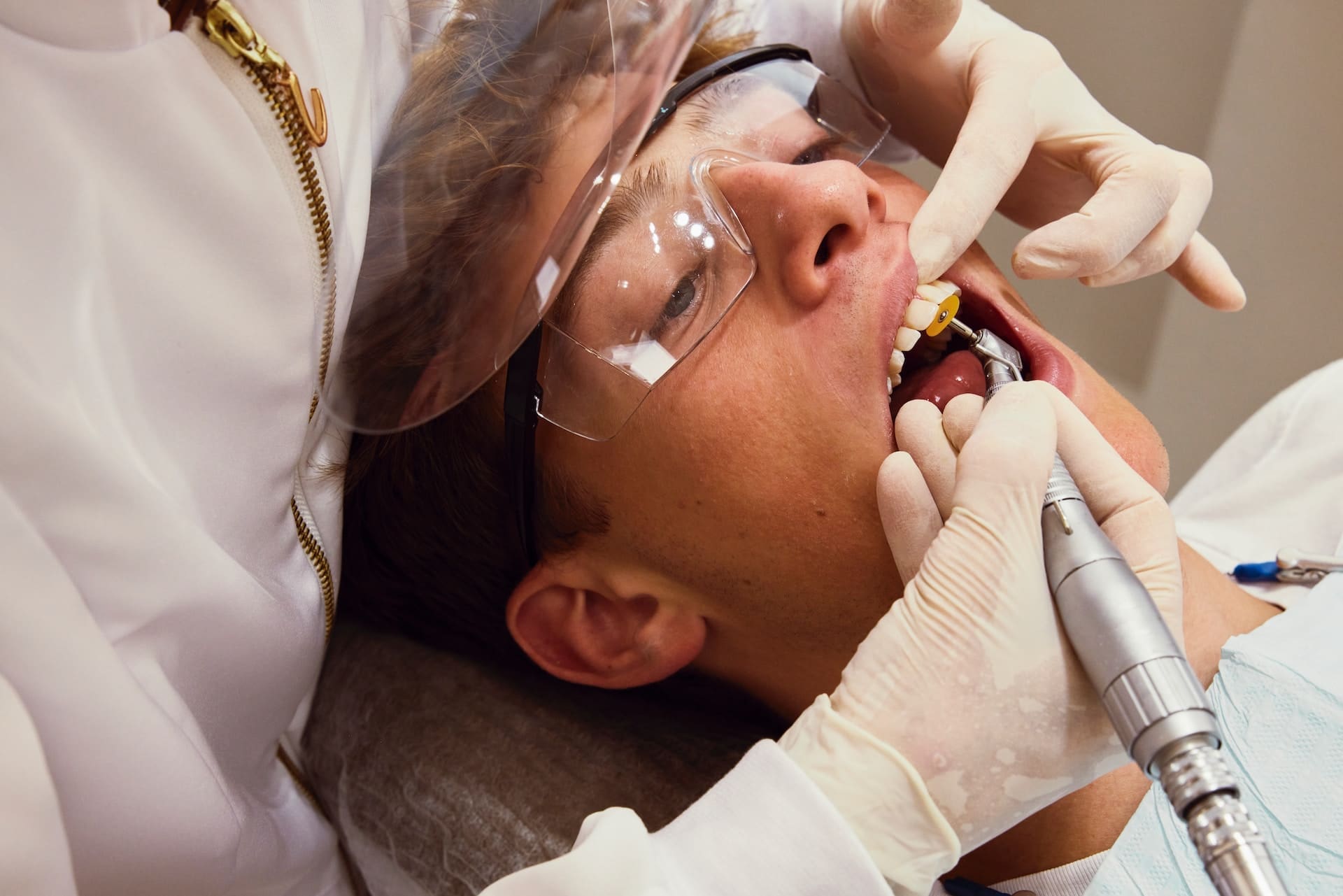 A patient receiving dental filling treatment at Sudbury Dental Arts in Sudbury, MA 01776.