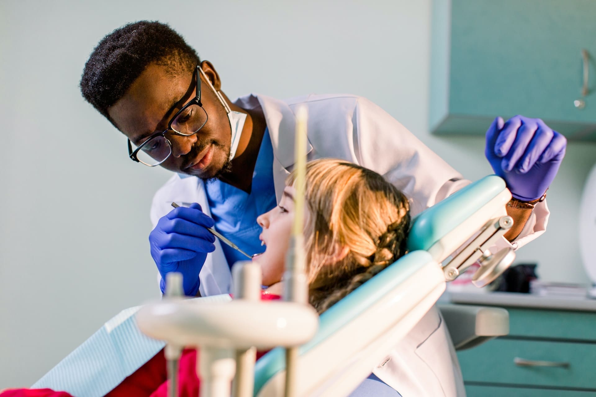 A patient undergoing a tooth extraction procedure at Sudbury Dental Arts, receiving expert care from dental professionals.