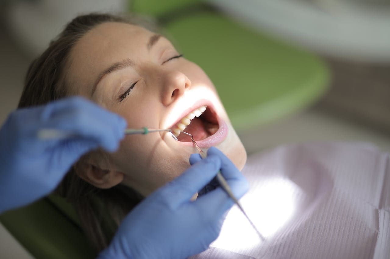 A dentist conducting a thorough examination of a patient's dental health.